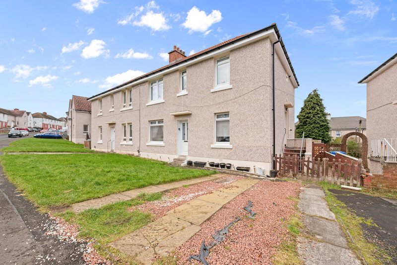 Semi-detached house with front garden, driveway and gravel pathway