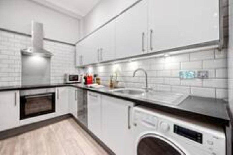 Bright, fully equipped kitchen with modern appliances and everything you need to prepare meals.