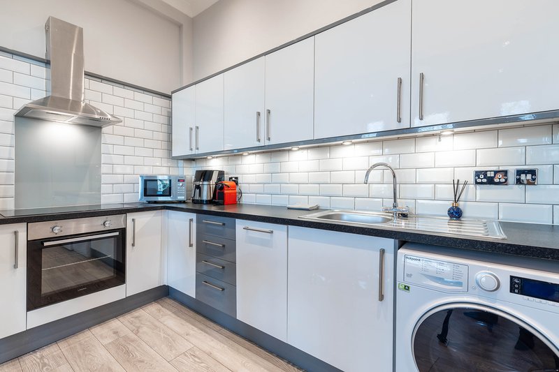 Cook with ease in the fully equipped modern kitchen featuring quality appliances and generous workspace. Whether preparing breakfast or a full evening meal, you'll have everything you need.
