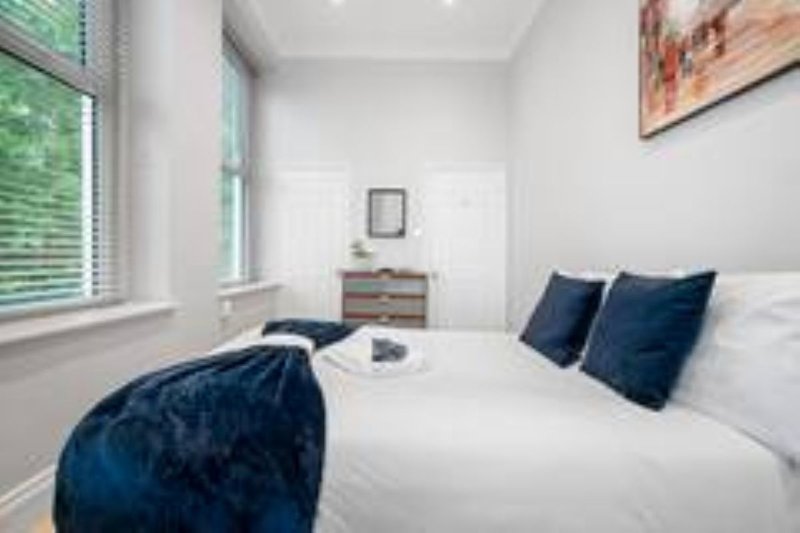 Recharge in this bright and spacious double bedroom, thoughtfully designed with comfortable furnishings and plenty of natural light. It's the perfect retreat for a peaceful night's sleep.