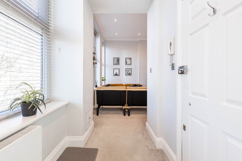 A clean and welcoming entrance provides easy access to every room in the apartment. Thoughtful décor and plenty of natural light create a warm first impression.