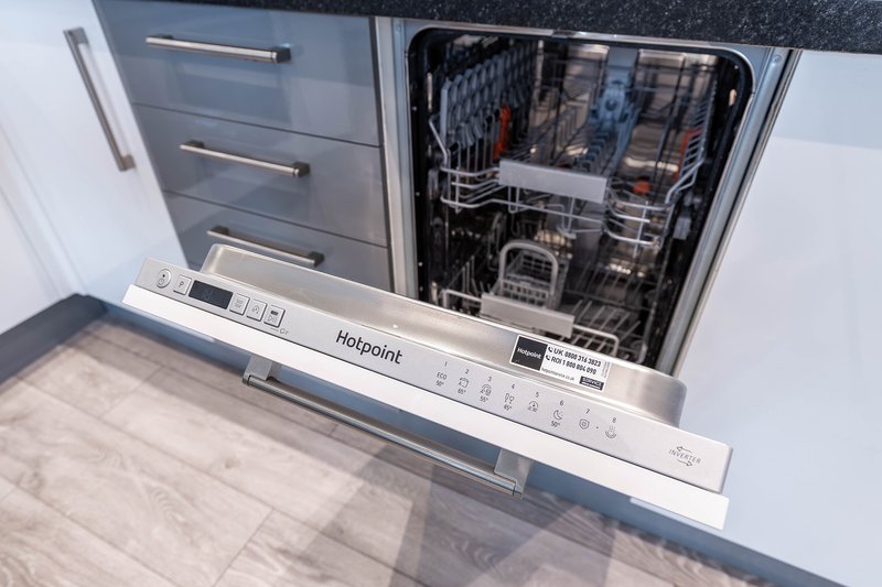 Contemporary kitchen featuring integrated appliances and ample space for everyday cooking.
