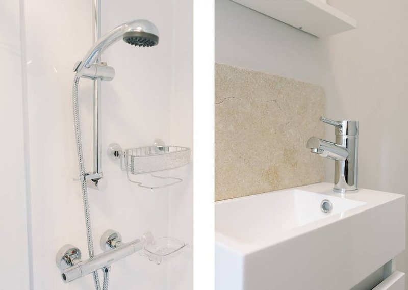 Two bathroom fixtures: shower system with rainfall head and shelf, and modern sink with chrome faucet