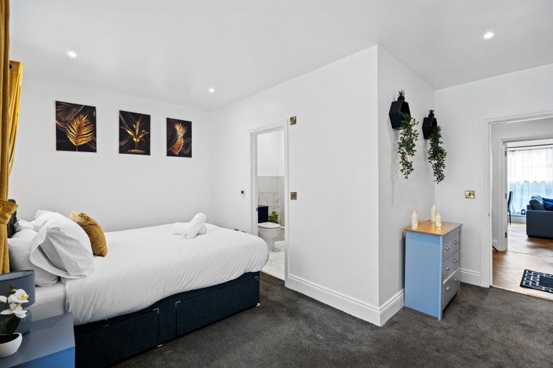 Twin bedroom configuration providing separate beds for colleagues sharing the apartment.