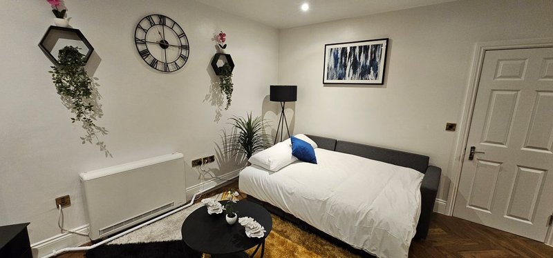 One of two sofa beds, providing additional sleeping space for larger teams when required.