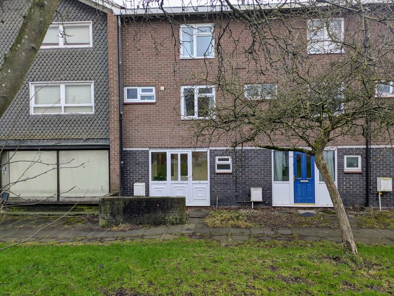 The property has a welcoming front entrance with a private doorway opening directly onto the residential surroundings. The home is set within a quiet and established neighbourhood.