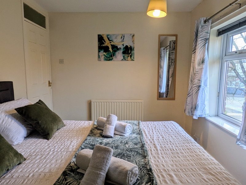 A cosy and well-presented bedroom, ideal for guests needing a comfortable place to unwind at the end of the day. The room features a king size bed and was designed with a good nights rest in mind