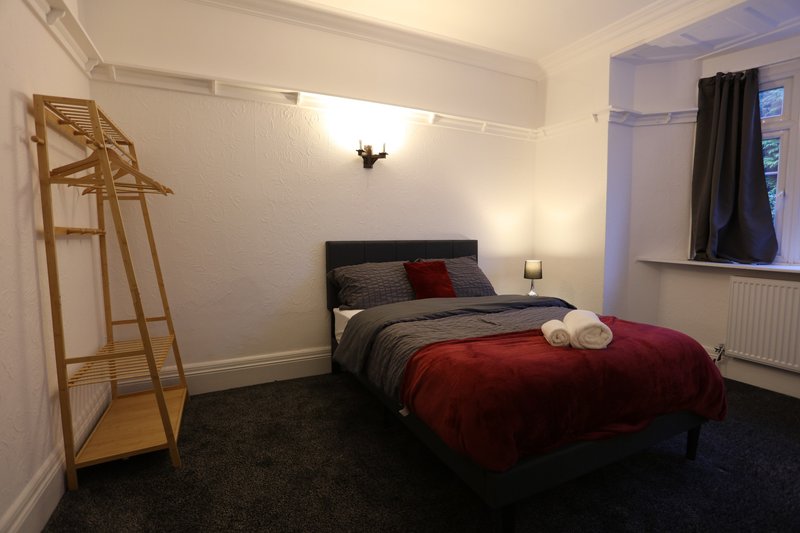 Well-sized double bedroom with a comfortable bed and a dedicated clothes rail for convenient storage. It a great private space for contractors to unwind and get a good nights rest.